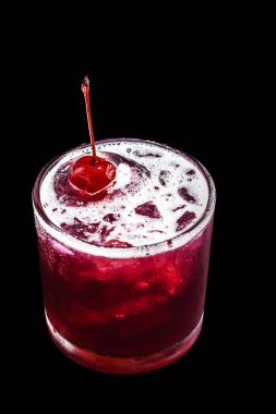 cherry-based refreshing alcoholic drink, red color, sweet taste, isolated black background, called cherry caipirinha or silk stocking