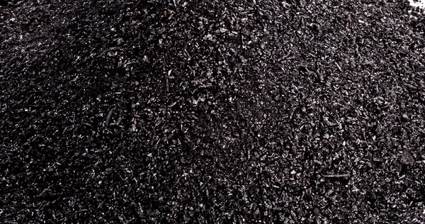 pile of coal dust isolated on white background, MACRO PHOTOGRAPHY