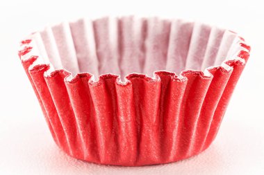 paper basket of candy on isolated background, brigadeiro packaging, typical candy from Brazil, white background