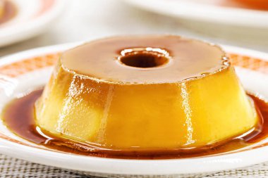 condensed milk pudding, sweet dessert with vanilla and caramel in syrup, made at home.