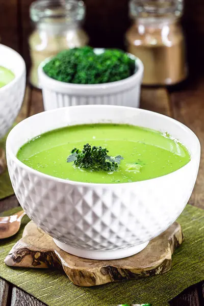 homemade soup of green vegetables, pea and broccoli, diet vegan soup served hot
