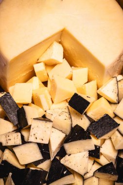 parmesan cheese with gorgonzola cheese, served on a wooden board, typical Brazilian food, served at parties and buffets clipart