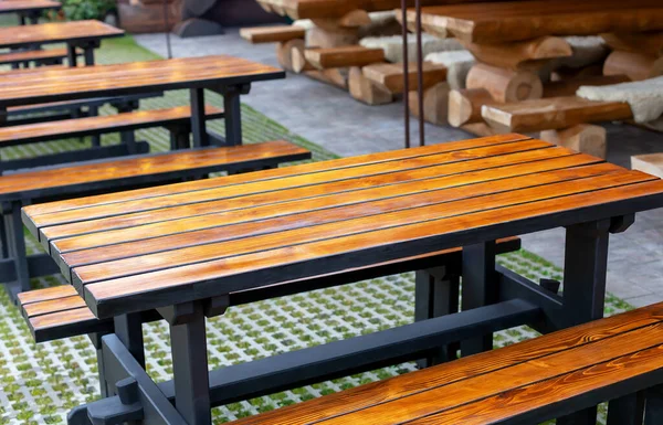 stock image Wooden tables with benches are lined up up outside