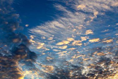 Beautiful sunset sky with clouds in the sunlight