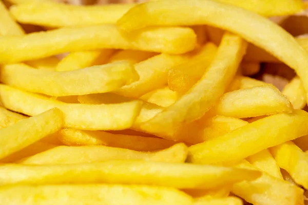 stock image Fresh tasty fried french fries in sunlight close up. Selective focus, defocus