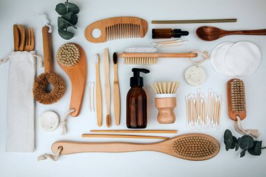 Set of wooden eco friendly devices. Brushes, washcloth and wooden comb, natural soap, ear sticks on a white background. Flat lay