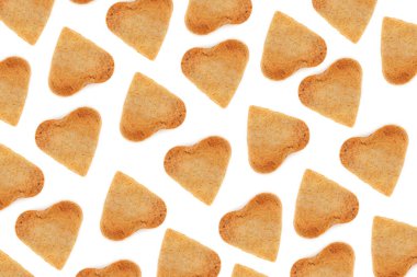 Shortbread cookies in the form of hearts on a white background. Valentines Day pattern. Flat lay