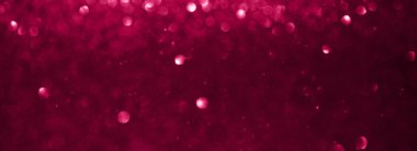 Viva magenta shiny blurred background for holiday design. Web banner abstract sparkles, selective focus