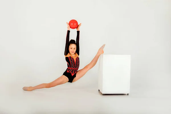 Girl Gymnast Black Leotard Red Ball Twine White Cube White — Stock Photo, Image