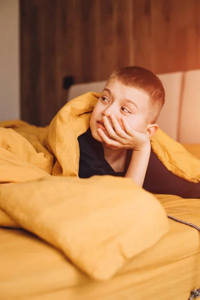 Joyful Boy Peers Out Yellow Blanket Boy His Bad Front — Stock Photo, Image