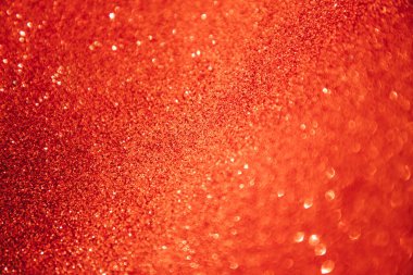 Tatil tasarımı için parlak, kırmızı, bulanık bir arka plan. Noel parlaklığı, seçici odaklanma