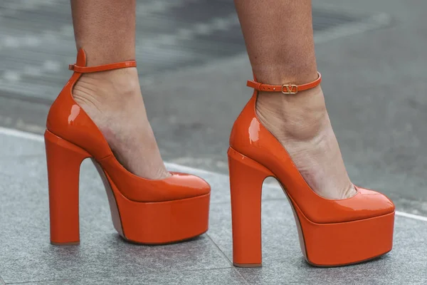 street style detail - woman wearing orange shoes