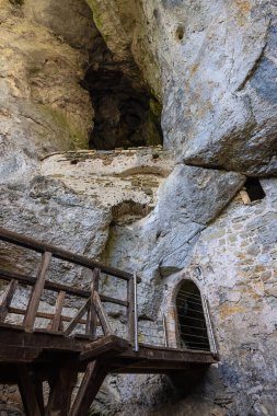 View into the cave of the Predjama castle which offers an overlook over the village
