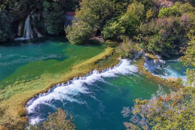 Water flowing from one level to another on de Krka river in the Krka National Park