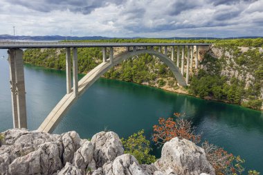 The highway bridge over the Krka River next to Skradin