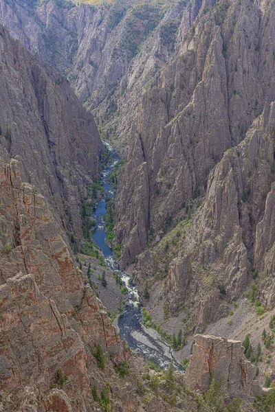 The Gunnison River pressed between the walls of the canyon at Kneeling Camel View on the north rim