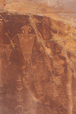 Manlike figure at the Cub Creek petroglyphs in the Dinosaur National Monument drawn by the Fremont people clipart