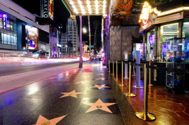 Stunning photograph capturing the iconic Hollywood Walk of Fame. This famous sidewalk stretches 1.3 miles along Hollywood Boulevard and features more than 2,600 terrazzo and brass stars embedded in clipart