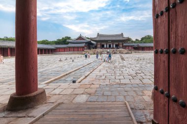 Changgyeonggung Palace, Seoul, July 8, 2023: Inner courtyard with stone-paved grounds, traditional architecture, and main hall view. clipart