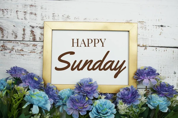 stock image Happy Sunday text message with flower decoration on wooden background