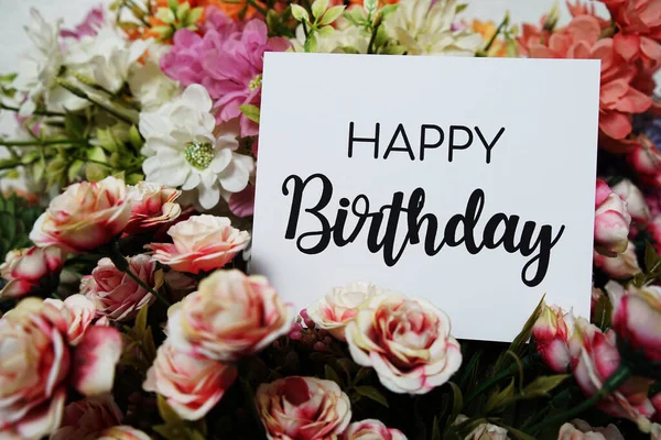 stock image Happy Birthday text message on paper card with beautiful flowers decoration