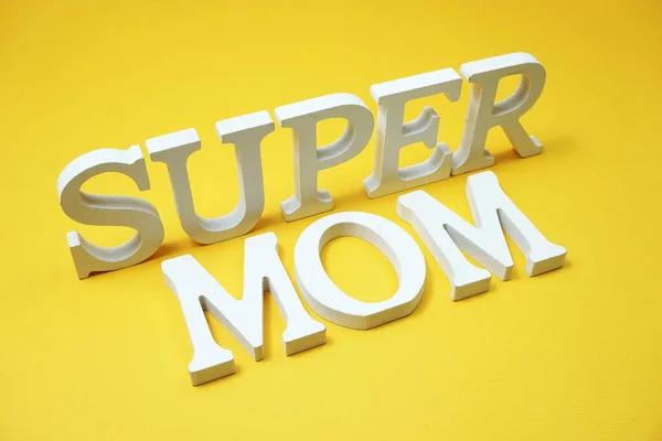 Super Mom alphabet letters on yellow background