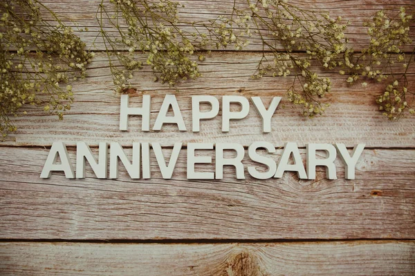 Happy Anniversary Alphabet Letters Flowers Frame Wooden Background — 스톡 사진