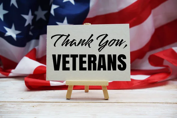 Thank You, Veterans text messege and USA flag. American holiday background