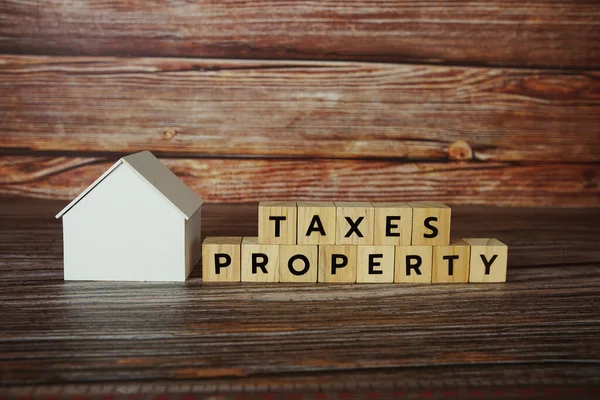 Property Taxes Alphabet Letter House Model Wooden Background — Stock Photo, Image