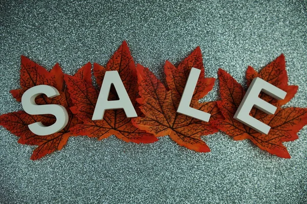 Sale alphabet letters with maple leaf Autumn and fall season promotion concept background