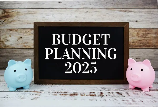 Budget Planning 2025 typography text message with piggy saving on wooden background