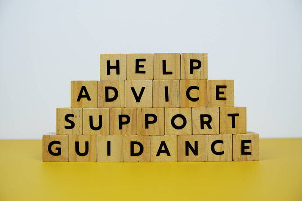 Help, Advice, Support, Guidance with wooden blocks alphabet letterstop view on wooden background