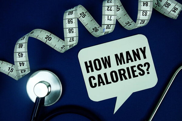How Many Calories? text on speech bubble with measure tape and stethoscope on blue background, Healthy concept