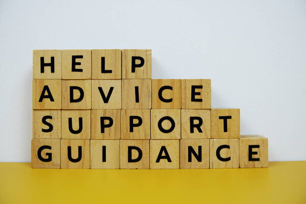 Help, Advice, Support, Guidance with wooden blocks alphabet letterstop view on wooden background