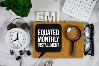 EMI - Equated Monthly Installment acronym with calculator, alarm clock and magnifying glass, Business and Financial concept background clipart