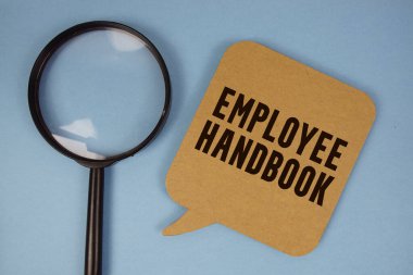 Mavi arkaplanda büyüteç bulunan Çalışan El Kitabı metni