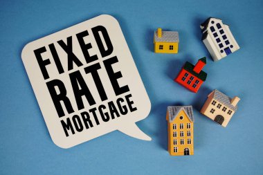 Fixed-Rate Mortgage text with house models on blue background