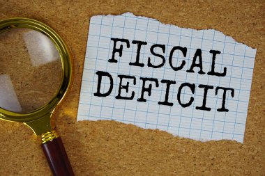 Büyüteçle kağıda yazılmış mali açık metni