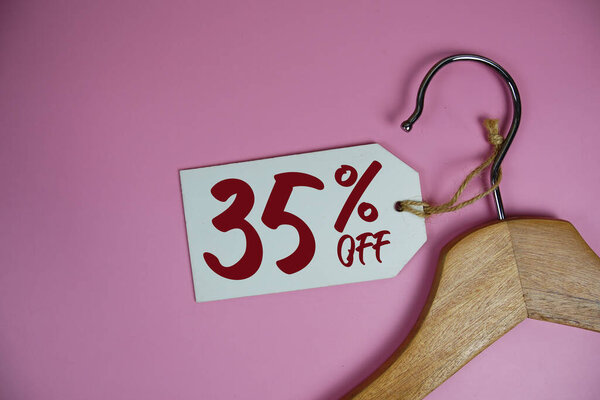 Sale 35% off price tag label with Clothes hanger Clothing Promotion shopping concept