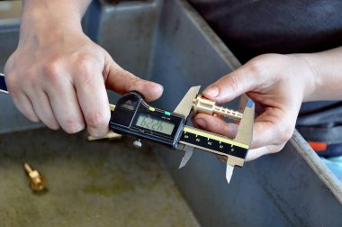 Detail of production control with digital caliper measurement