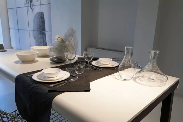 Table set in a modern setting with runner