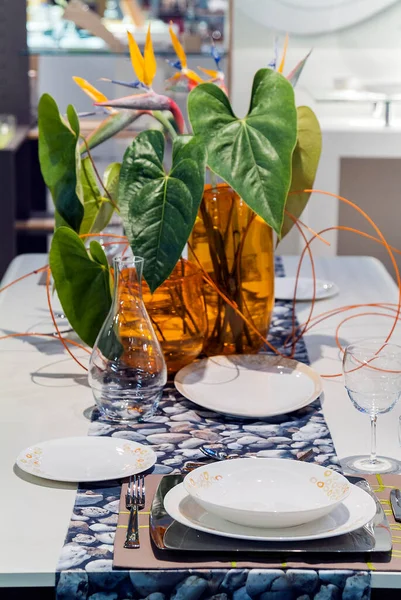 Table set in a modern setting with runner