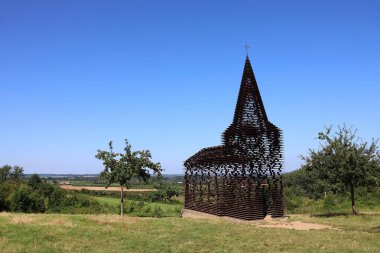 Borgloon, Belgium, 7-28-2024. See-through church 'Reading between the lines' in Borgloon, Belgium. clipart