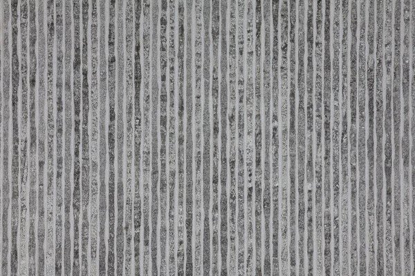 Gray stone texture with vertical lines. Stone background.