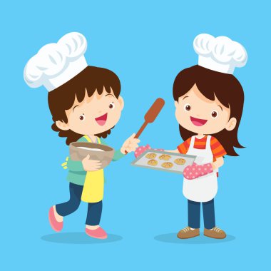 Sevimli küçük aşçı çocuklar kurabiye pişirir Sevimli çocuk aşçı oğlan ve kız mutfakta yemek pişirir
