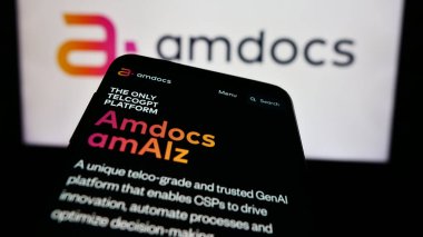 Stuttgart, Germany - 05-27-2024: Smartphone with webpage of Israeli telecom technology company Amdocs Limited in front of business logo. Focus on top-left of phone display. clipart