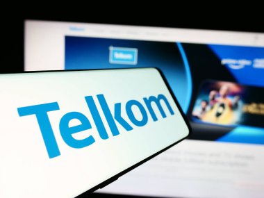 Stuttgart, Germany - 06-11-2024: Mobile phone with logo of South African company Telkom SA SOC Limited in front of business website. Focus on center-left of phone display. clipart