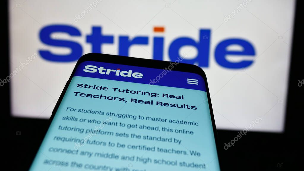 Stuttgart, Germany - 07-08-2024: Mobile phone with webpage of US online education company Stride Inc. in front of business logo. Focus on top-left of phone display.