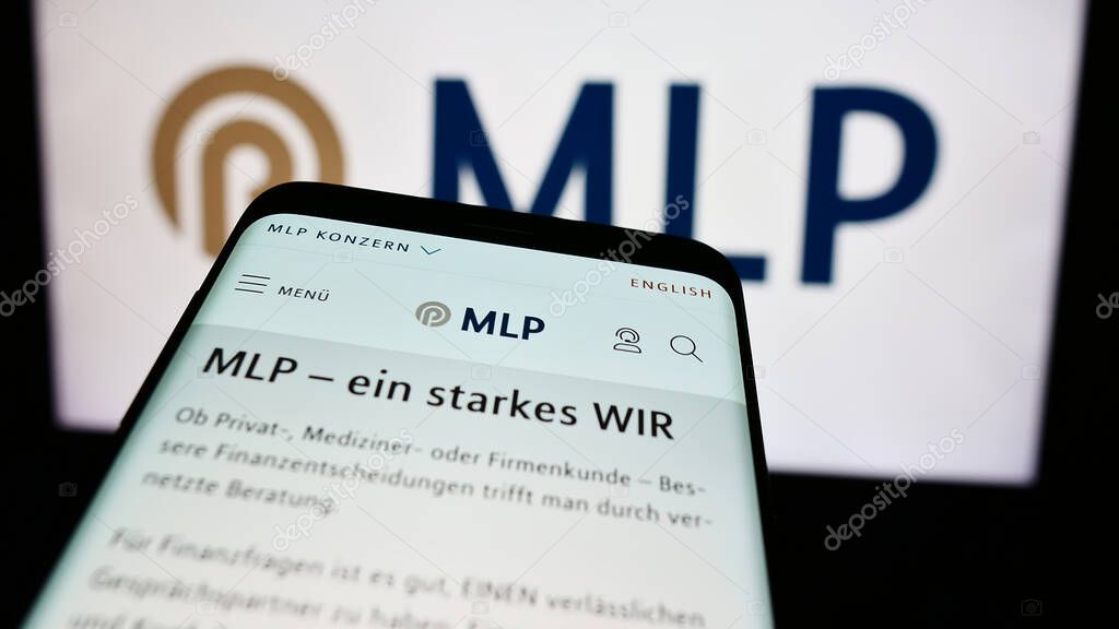 Stuttgart, Germany - 07-15-2024: Cellphone with web page of German financial services company MLP SE in front of business logo. Focus on top-left of phone display.