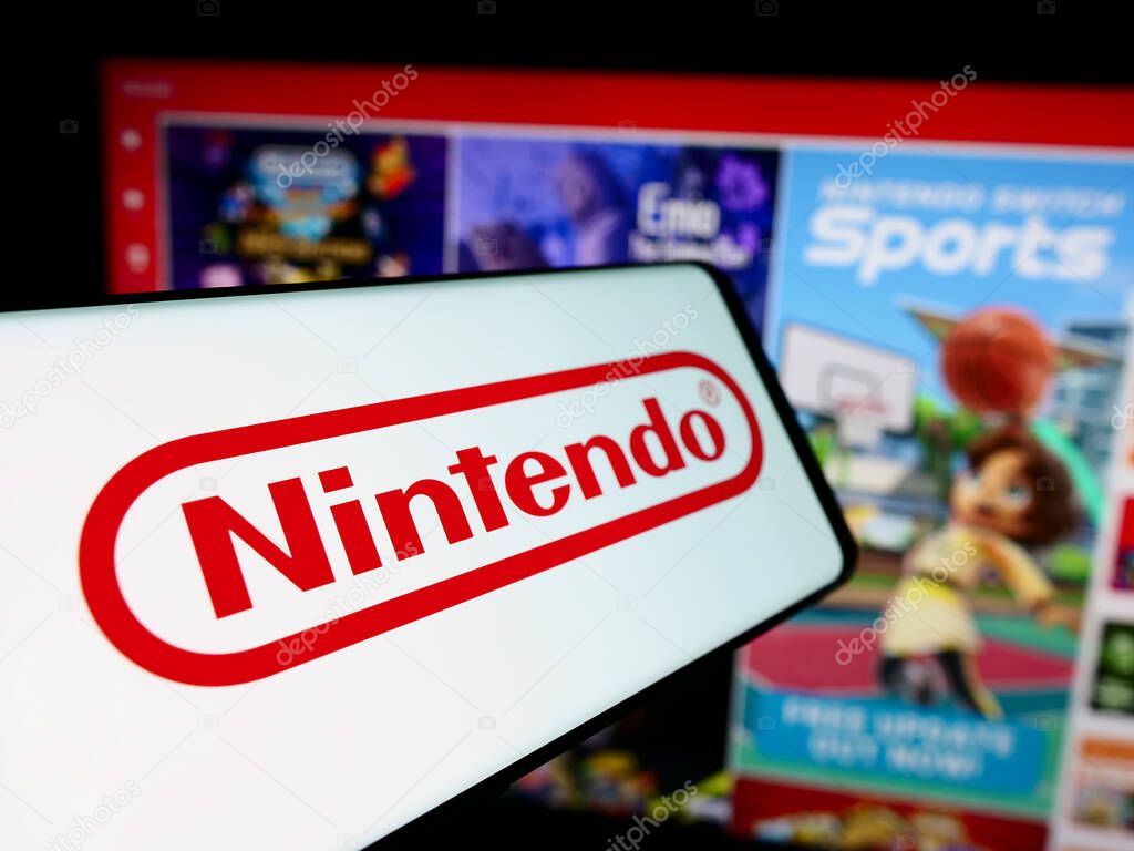 Stuttgart, Germany - 07-19-2024: Mobile phone with logo of Japanese video game company Nintendo Co. Ltd. in front of business website. Focus on center-left of phone display.